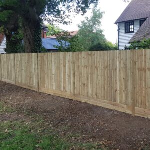 Closeboard fencing built on site from individual components gives the ability to work around tree roots and ground contours
