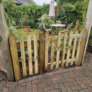 This palisade gate was installed to provide an alternative access to the shared garden and patio within