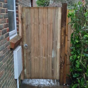 Closeboard gate installed to replace a broken old gate to provide a secure entrance to the garden